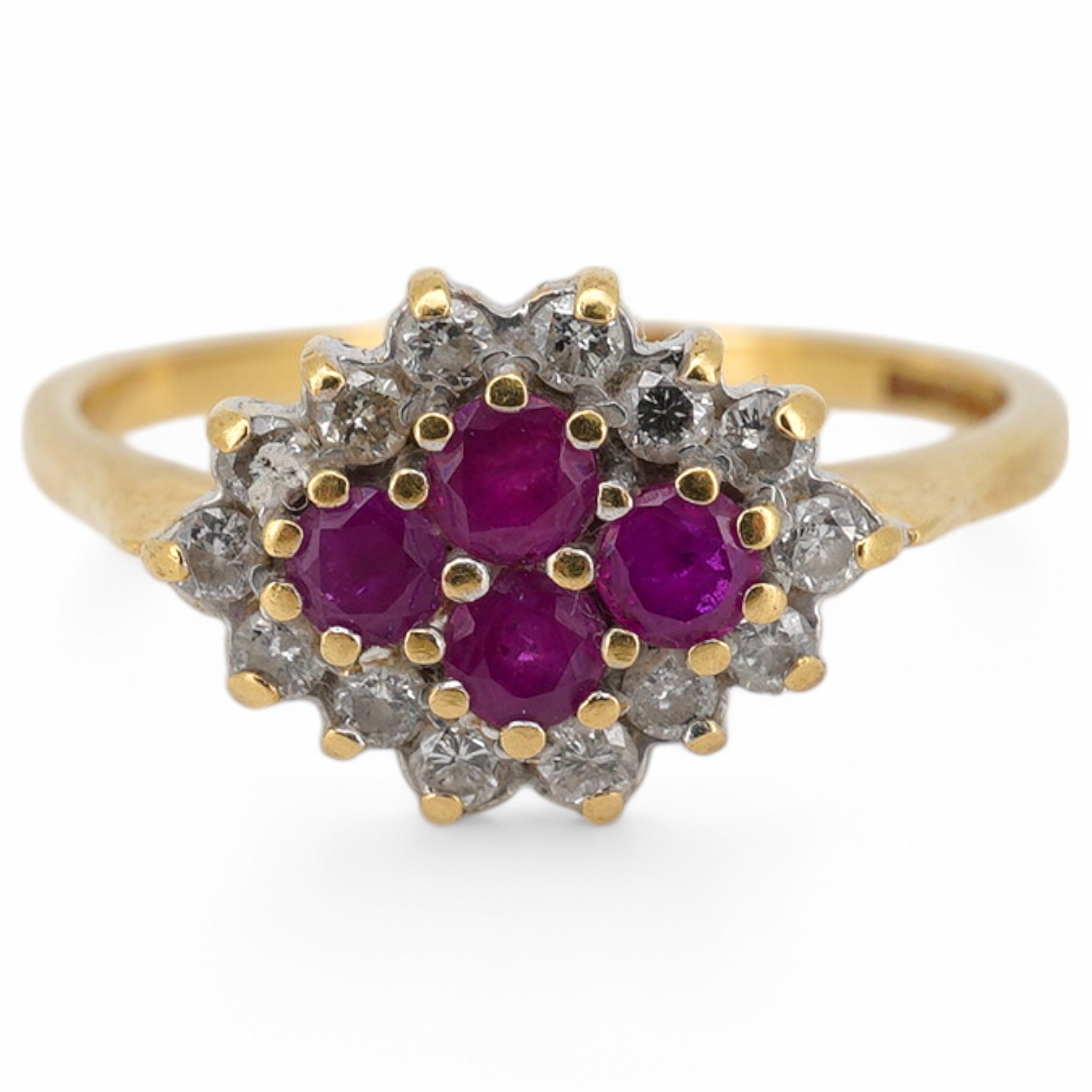 A ruby and diamond ring, designed as a lozenge-shaped cluster, set with four circular-cut rubies within a border of circular-cut diamonds, mounted in 18ct gold, size O, British hallmarks, gross weight 3 grams, Condition: